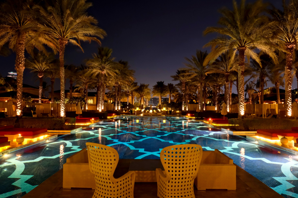 the hotel pool at night by supergold